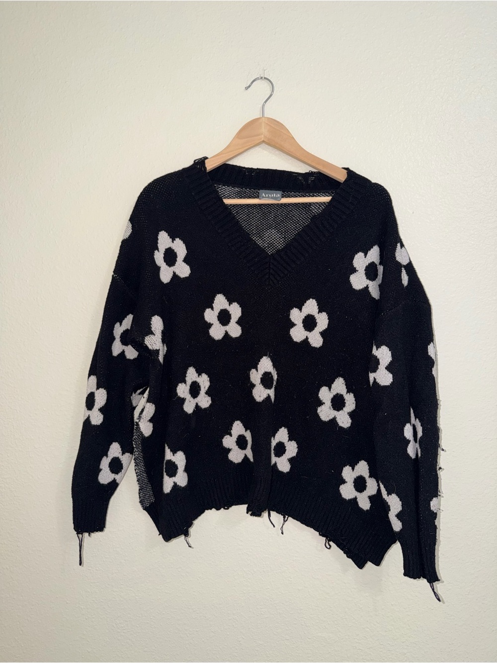 ARULA Distressed Black V-Neck Sweater with White Floral Pattern